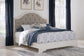 Brollyn King Upholstered Panel Bed with Mirrored Dresser