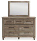 Yarbeck Queen Panel Bed with Mirrored Dresser and Chest
